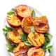 grilled peaches on platter with mint garnish and text