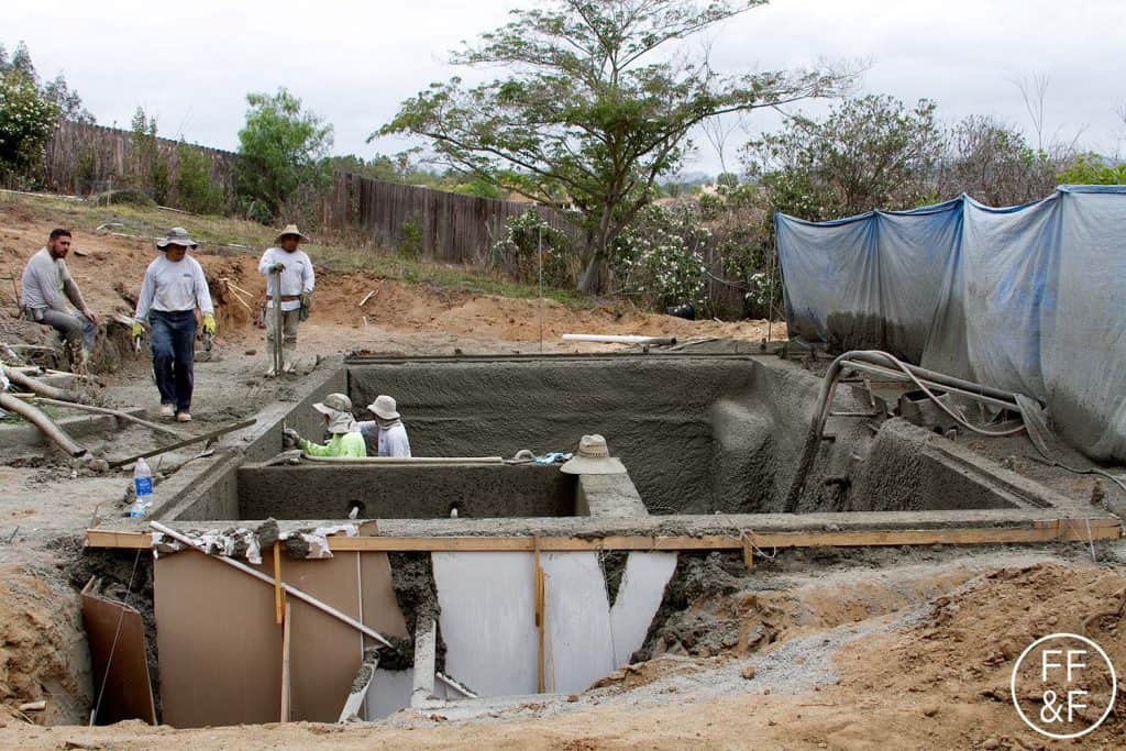 Smoothing out the concrete for the pool. #bethhomeproject