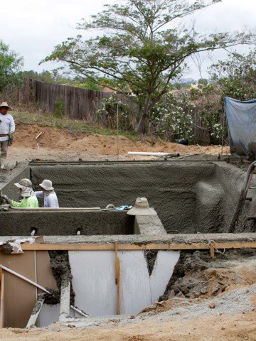 Smoothing out the concrete for the pool. #bethhomeproject