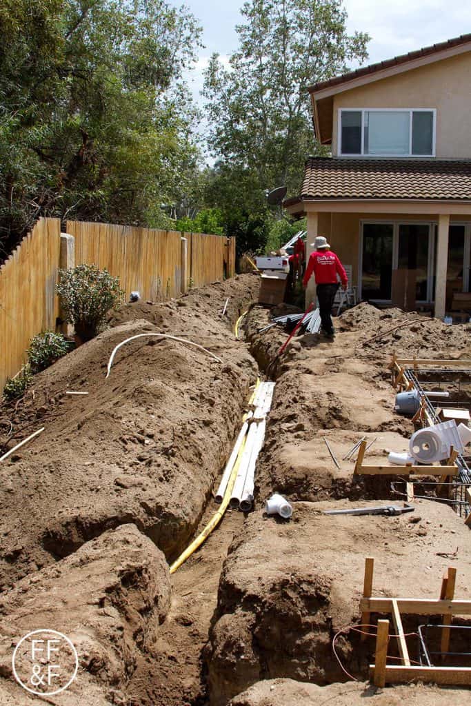Plumbing and electrical pipes in the trenches for the pool. #bethhomeproject