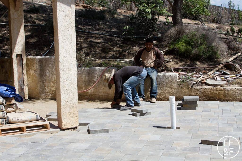 Placing the pavers to extend the entertaining space in the backyard. #bethhomeproject