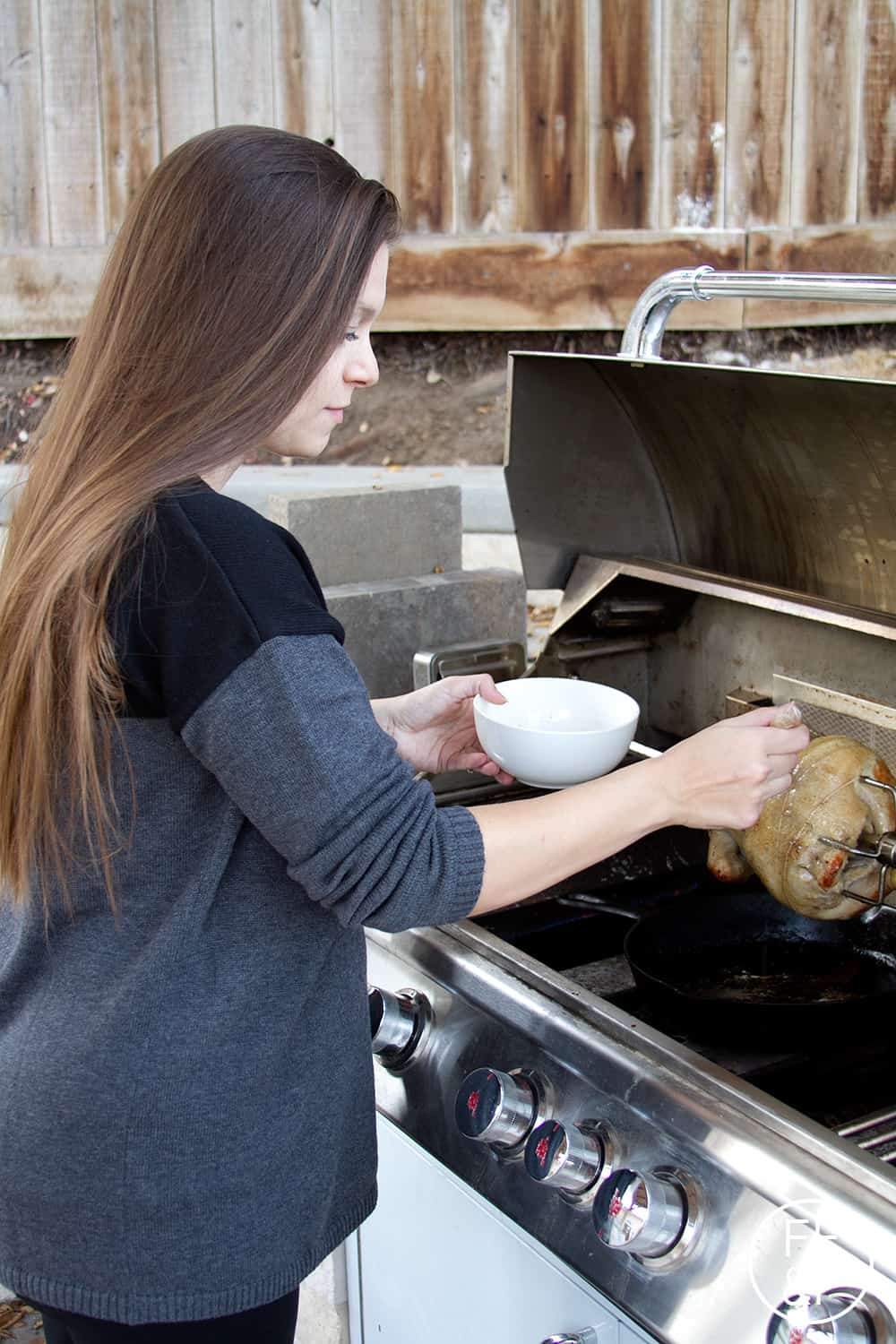 Basting the bird! Click for the Simple Rotisserie Chicken recipe + Tips for Using a Rotisserie