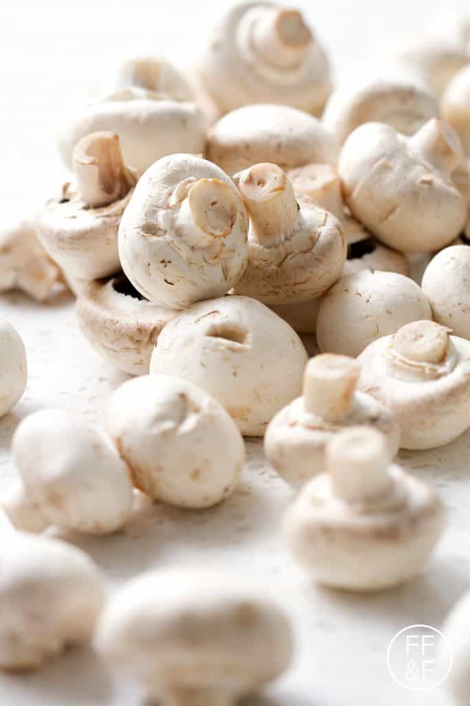 Button mushrooms that are braised in wine and Italian Seasonings. It's super simple, delicious and perfect for those following a vegan, autoimmune protocol diet or people that just want a really great side.