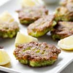 fish cakes on platter on white background