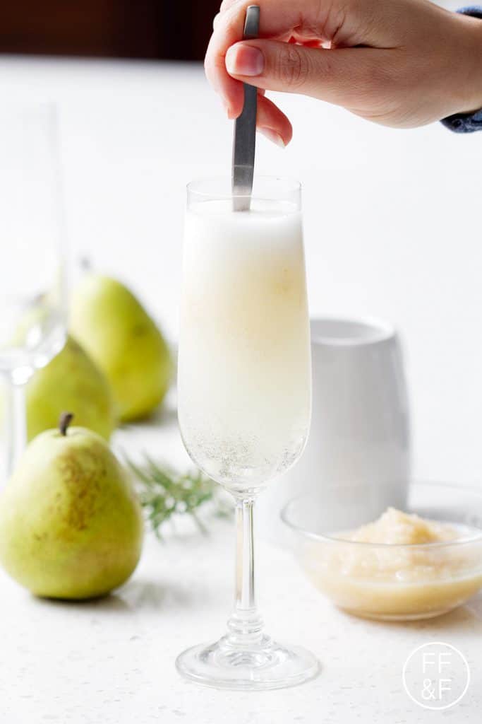 A Rosemary Pear Sparkler is a savory sweet mix of fresh herbs and sweet pears topped with sparkling wine or champagne.