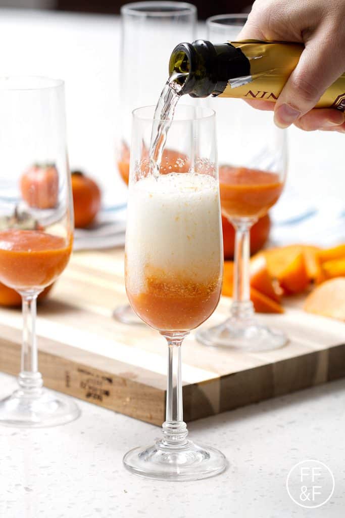 Spiced Persimmon Sparkler is a cinnamony champagne cocktail with a fruity persimmon puree.