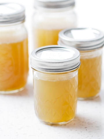 mason jars filled with healing chicken broth