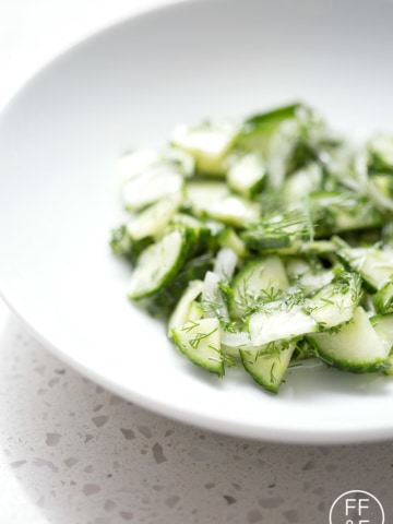 close up of bowl of cucumber dill salad