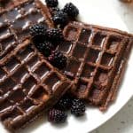 plate of plantain waffles with blackberries