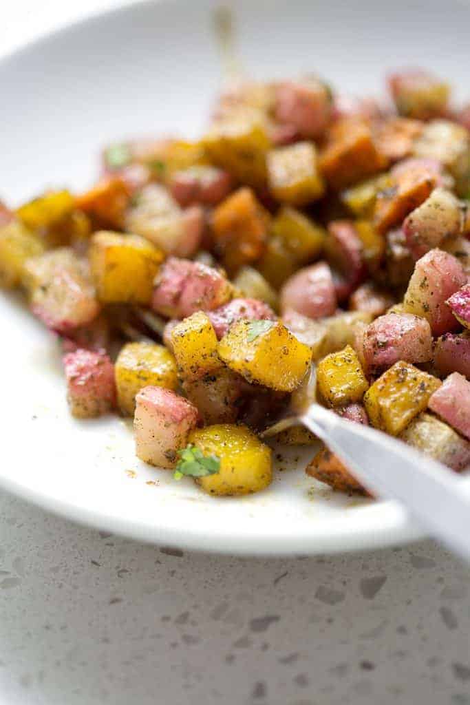 This recipe for Roasted Root Vegetables uses radishes, sweet potatoes and beets with just a few other ingredients to make a colorful and hearty veggie side dish. It’s time to make this dish an AIP veggie go-to for healthy, delicious and easy meals. This recipe is allergy friendly (gluten, dairy, shellfish, nut, egg, and soy free) and suits the autoimmune protocol (AIP) and paleo diets.
