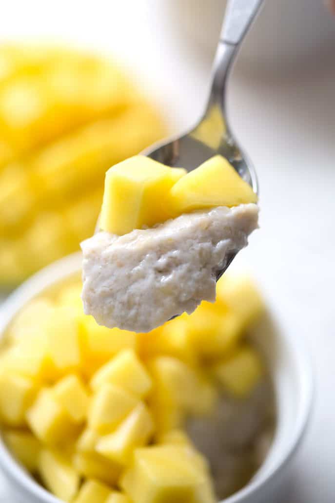 spoonful of 'sticky rice' and chopped mangoes