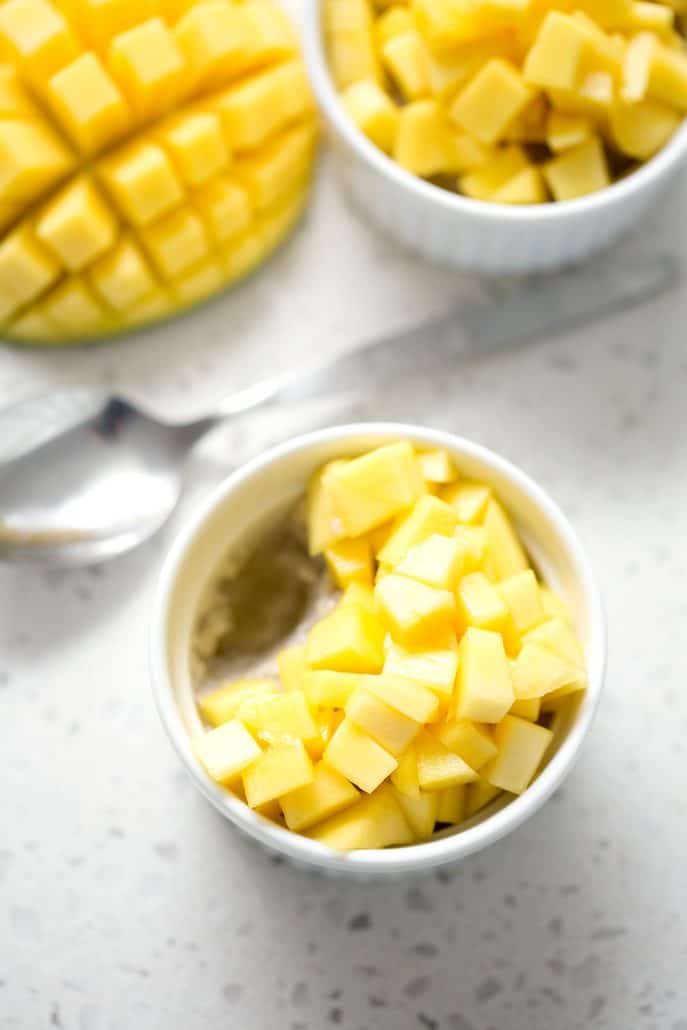 ramekins of chopped mangoes and 'sticky rice' with sliced mango