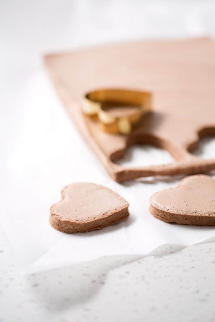 heart shaped cookie cutter cutting chocolate marshmallows