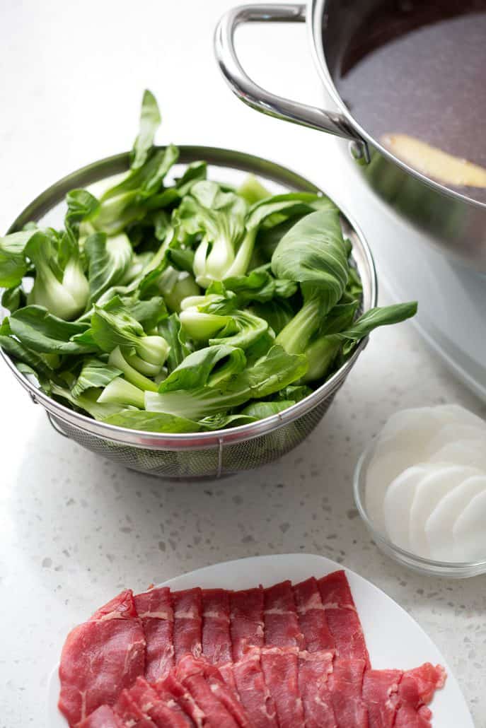 bok choy with hot pot pan in background