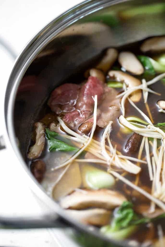 mushrooms, beef and bok choy in bone broth