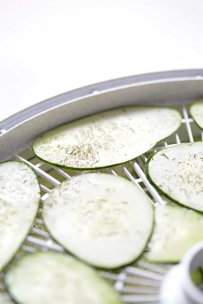 seasoned cucumbers in dehydrator tray