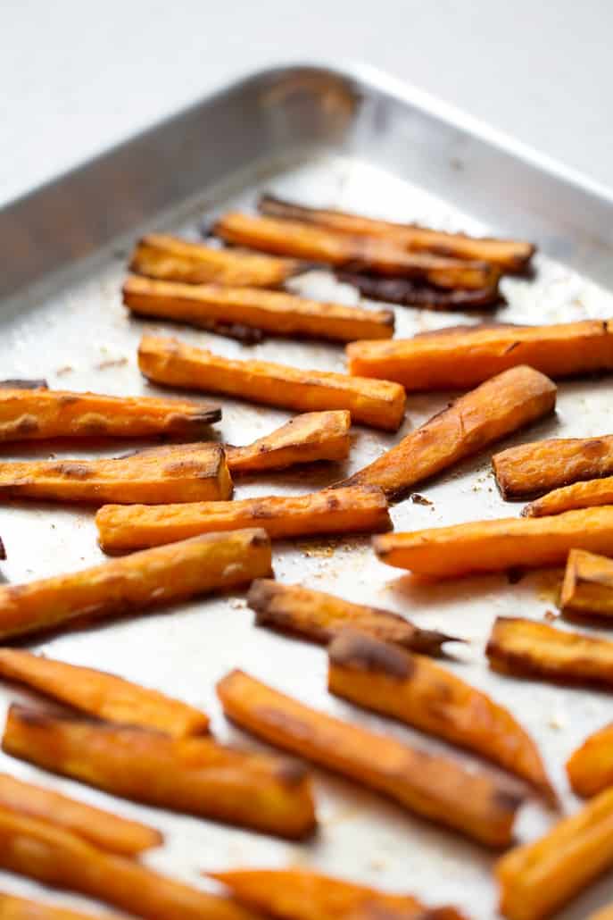 crispy sweet potato fries on baking sheet