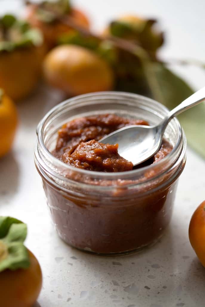 Persimmon season is a short one but I encourage you to scoop them up and make this Spiced Persimmon Butter. It’s similar to pumpkin or apple butter but made with persimmons and some extra spices for those yummy fall and winter flavors. This recipe is allergy friendly (gluten, dairy, shellfish, nut, egg, and soy free) and suits the paleo diets