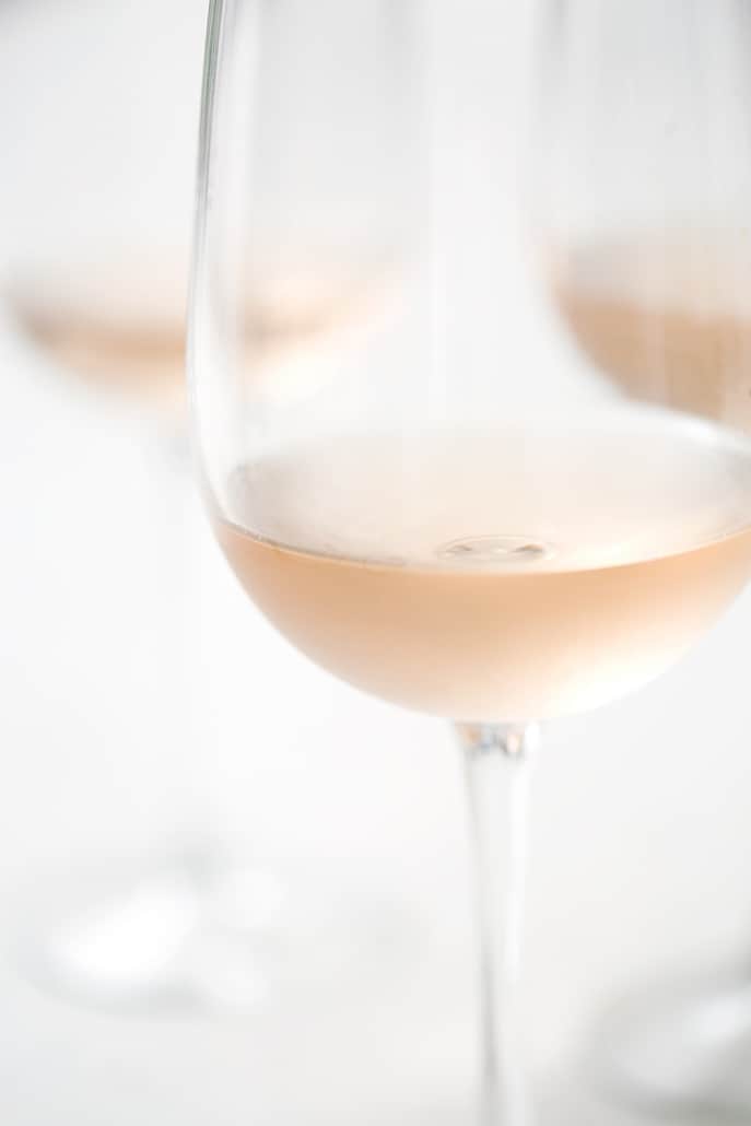 close up of rose filled wine glass