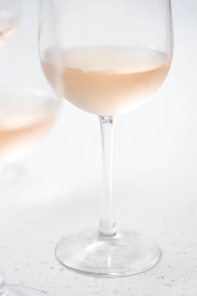 close up of rose filled wine glass