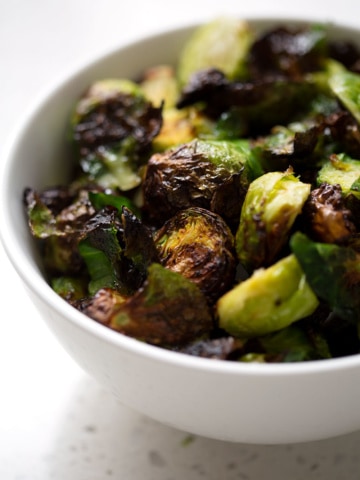 This AIP Air Fryer Brussel Sprouts recipe can be made in under 30 minutes and is the easiest way to cook brussel sprouts that are crispy and delicious. This recipe suits the Autoimmune Protocol (AIP), Paleo, and Vegan diets.