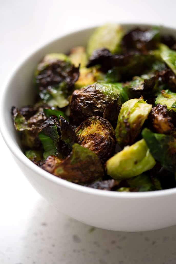 This AIP Air Fryer Brussel Sprouts recipe can be made in under 30 minutes and is the easiest way to cook brussel sprouts that are crispy and delicious. This recipe suits the Autoimmune Protocol (AIP), Paleo, and Vegan diets.