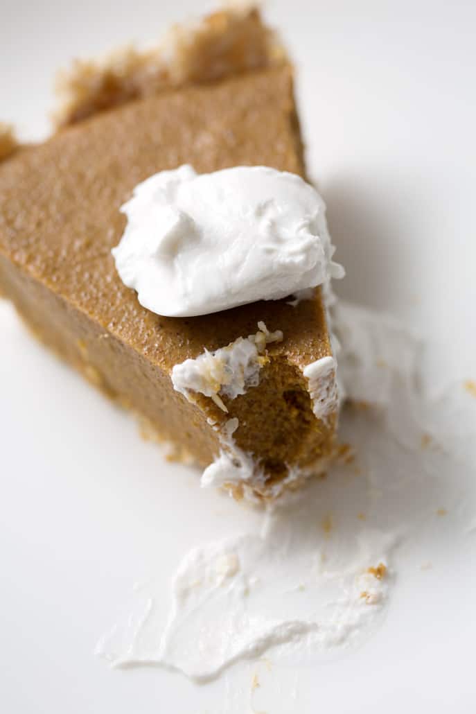 piece of pumpkin pie with dollap of cream