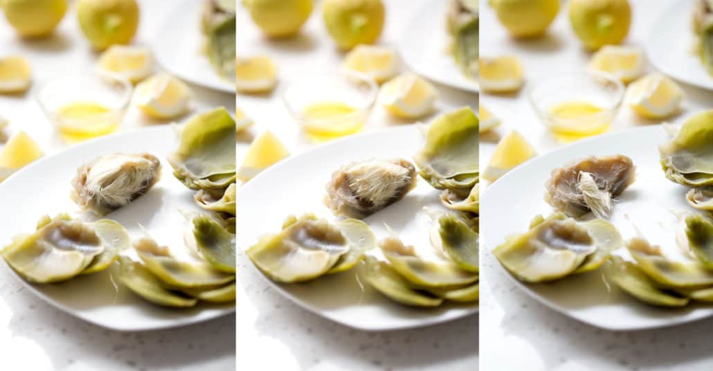 artichoke hearts with and without hair on a white plate