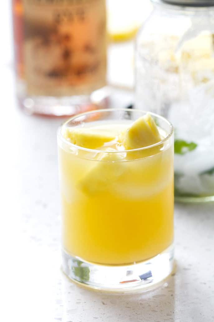 cocktail glass with pineapple chunks