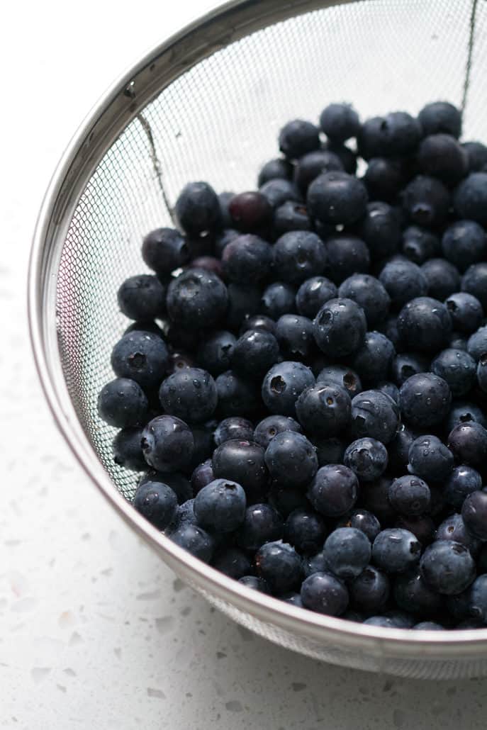 blueberries in wire mesh strainer