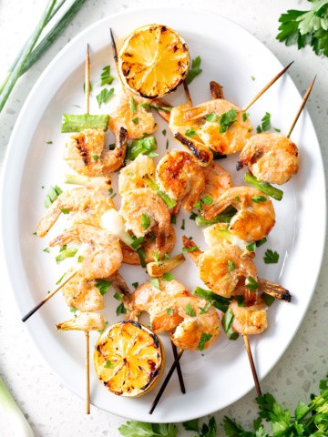grilled shrimp skewers on platter