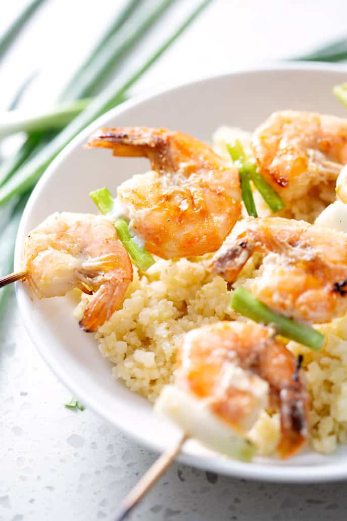 grilled shrimp and green onions on skewers