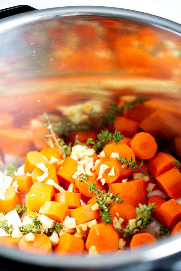 carrots, onions and herbs in instant pot 