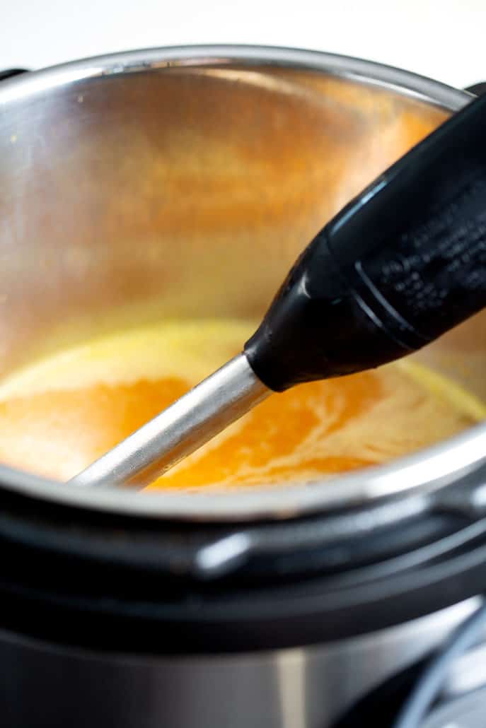 immersion blender in instant pot with carrot ginger soup