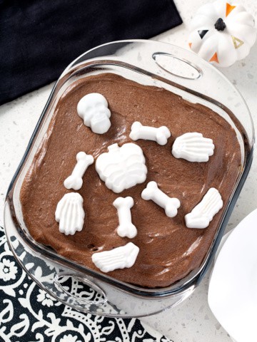 chocolate cake from above with skeleton mold on top