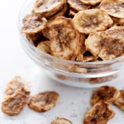 bowl of dehydrated banana chips on white counter
