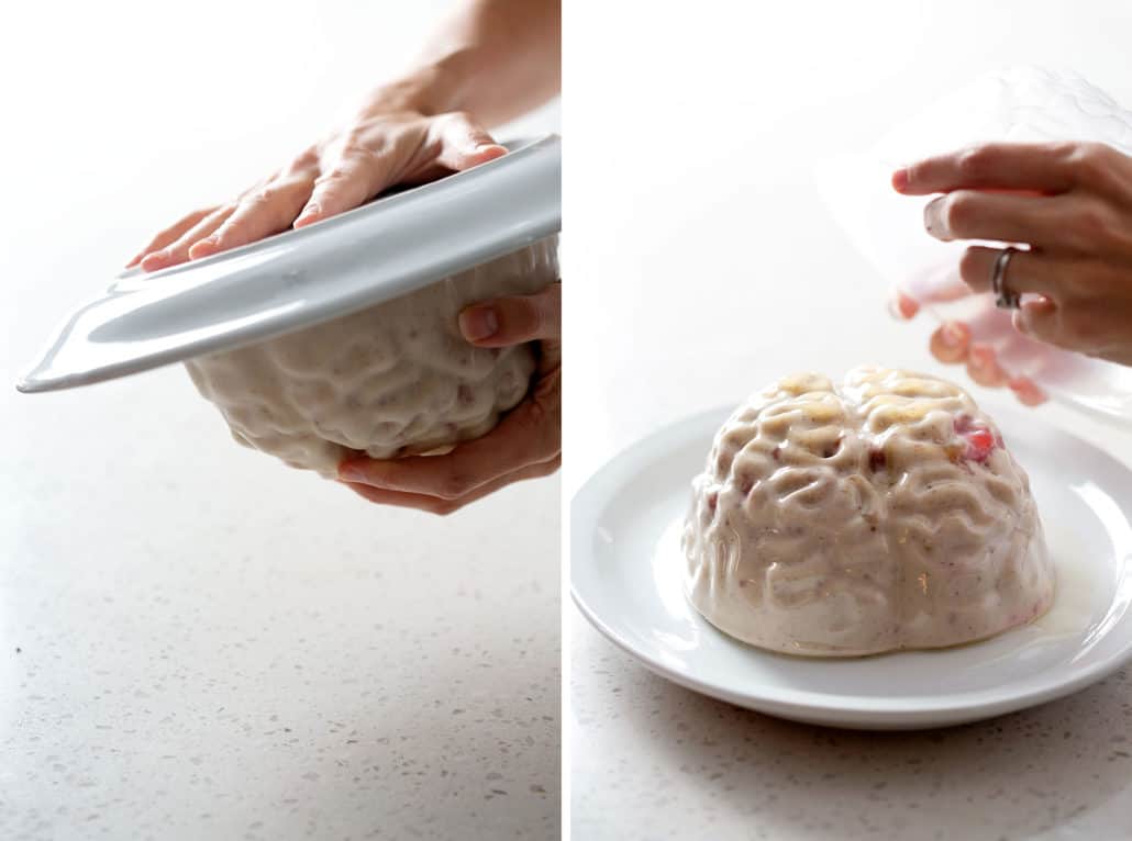 flipping brain jello mold onto plate and removing mold on white background