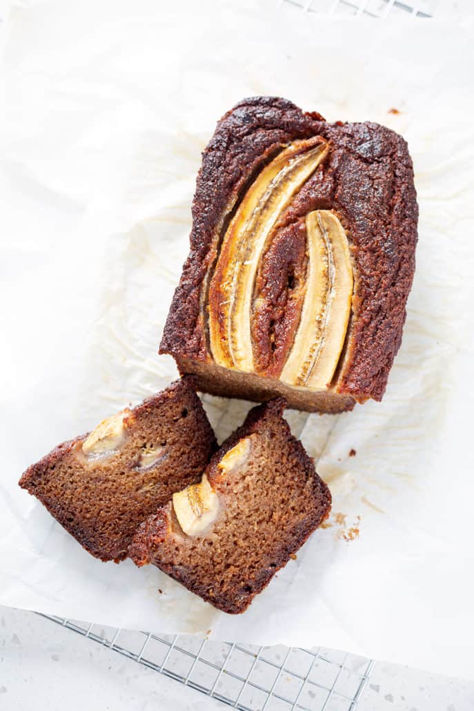 AIP Banana Bread loaf with slices on white background