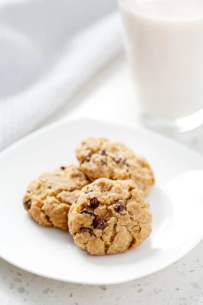 plate of chocolate chip cookies with glass of milk
