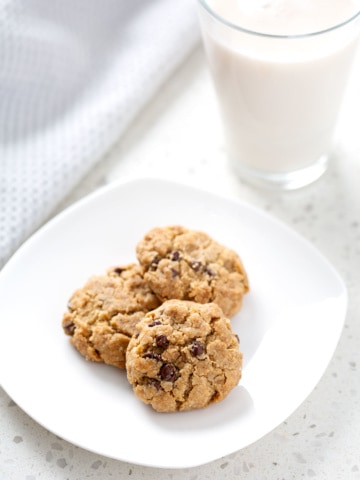 plate of aip chocolate chip cookies with glass of milk
