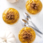 pumpkin pudding cups from above with pumpkins and spoons