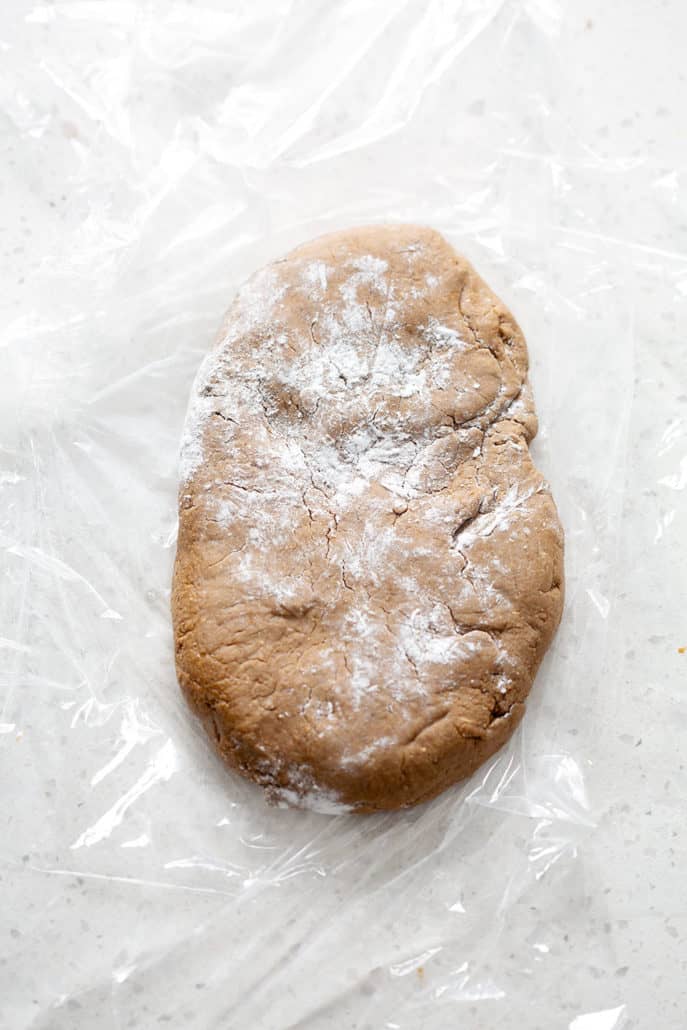 wrapping aip gingerbread dough in plastic wrap
