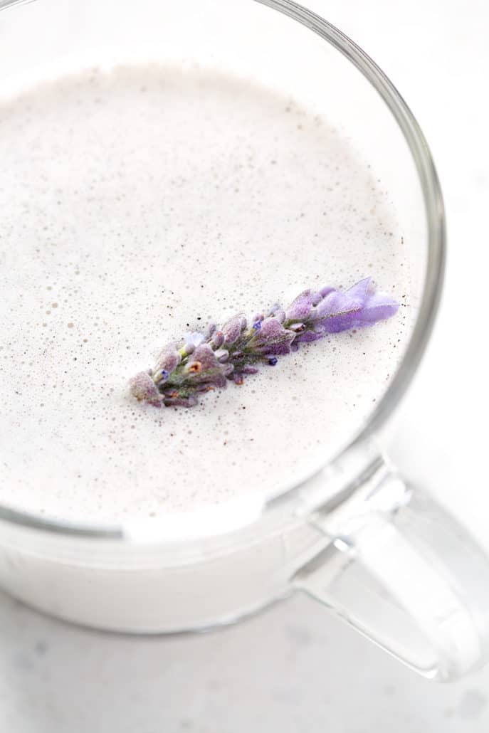 close up of Lavender Milk Tea with fresh sprig of lavender floating on top