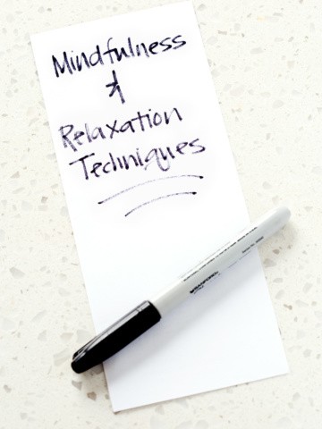 piece of paper with the words mindfulness and relation techniques and a sharpie