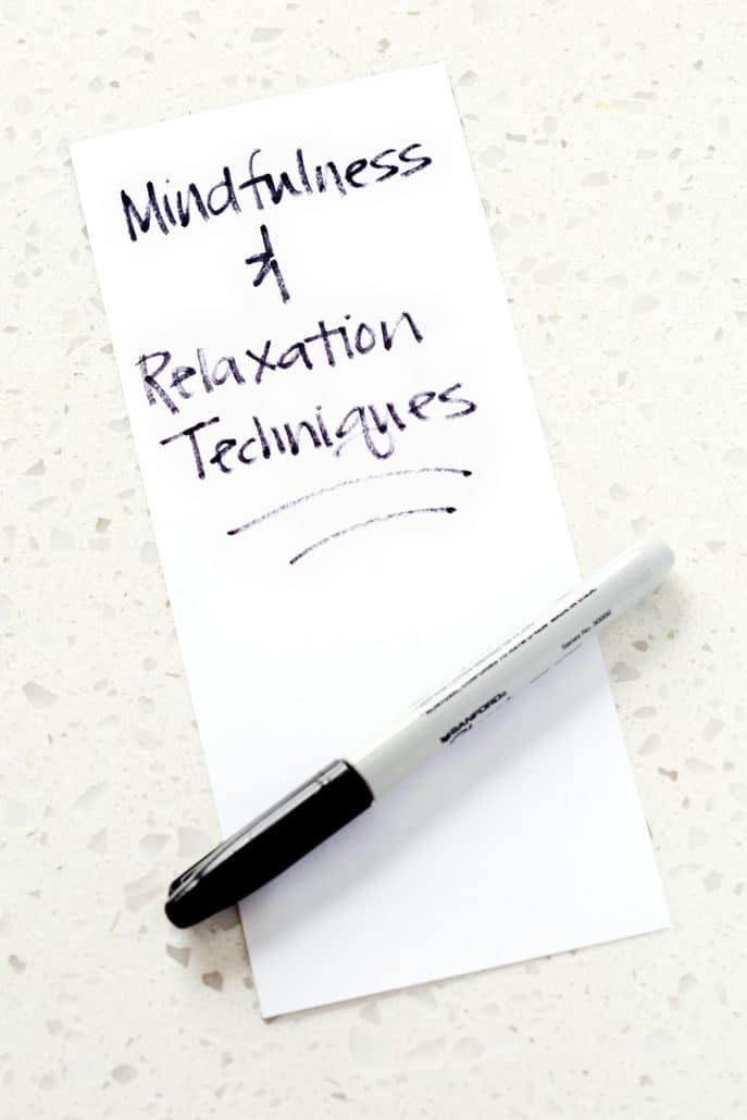 piece of paper with the words mindfulness and relaxation techniques written out and a sharpie