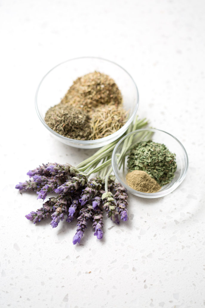 dried herbs and spices on white background