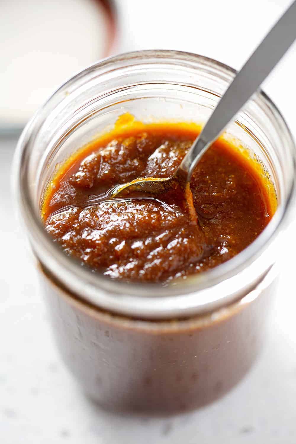 spoon in AIP BBQ Sauce in mason jar