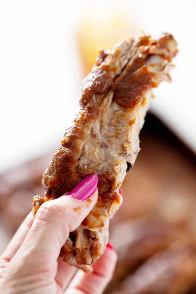 holding up Instant Pot AIP BBQ Rib