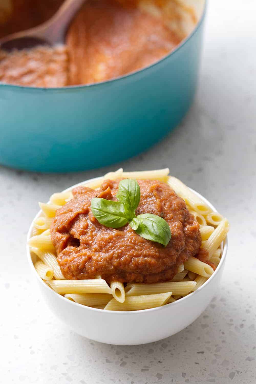 bowl of pasta with Easy Nomato Marinara Sauce (AIP) and basil on top