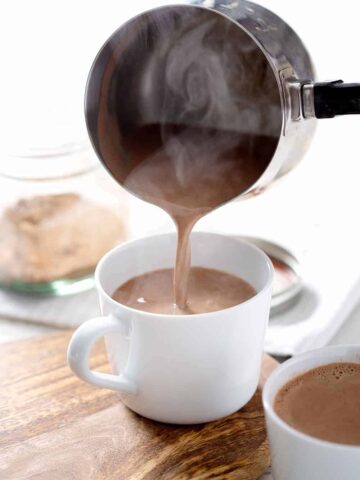 pouring AIP Hot 'Chocolate' into mug with steam